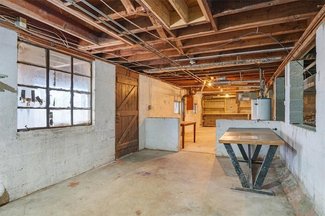 basement featuring water heater