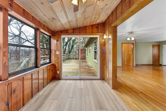 55 Ridgeway Ave, Eureka Springs, AR 72632 - entryway featuring a ceiling fan, lofted ceiling, wooden walls, light wood-style floors, and healthy amount of natural light
