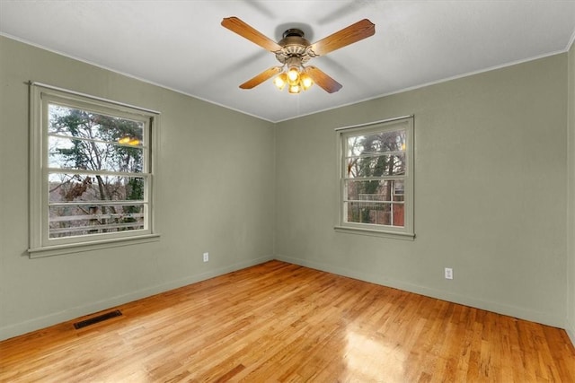 unfurnished room featuring light hardwood / wood-style floors and ceiling fan