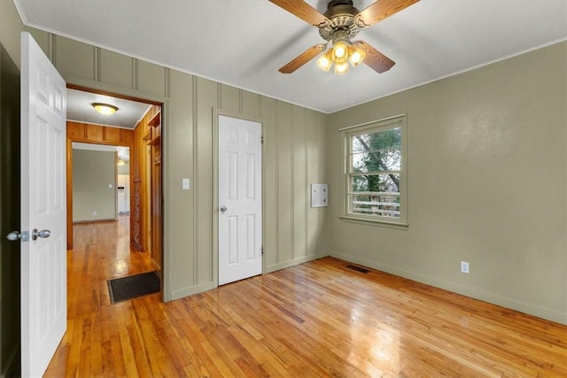 unfurnished bedroom featuring light wood-type flooring and ceiling fan