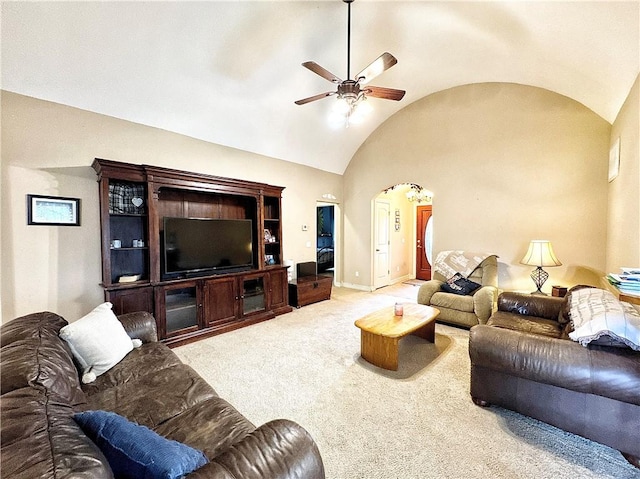 carpeted living room featuring vaulted ceiling and ceiling fan