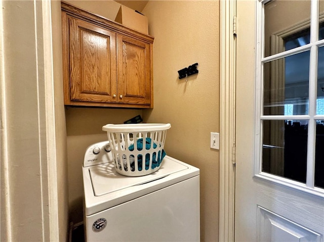 laundry area featuring cabinet space and washer / clothes dryer