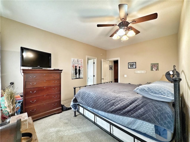 bedroom featuring a ceiling fan and carpet