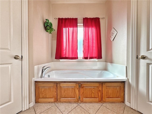 bathroom featuring a garden tub and tile patterned floors