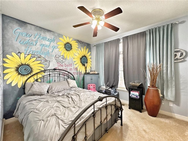 bedroom with a textured ceiling, carpet floors, and baseboards