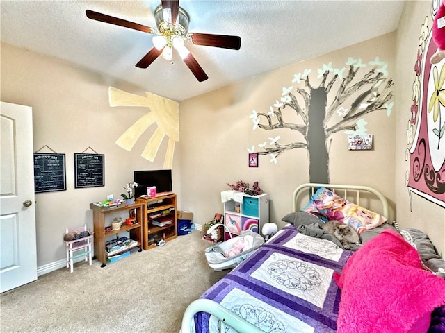 bedroom with carpet floors, ceiling fan, baseboards, and a textured ceiling