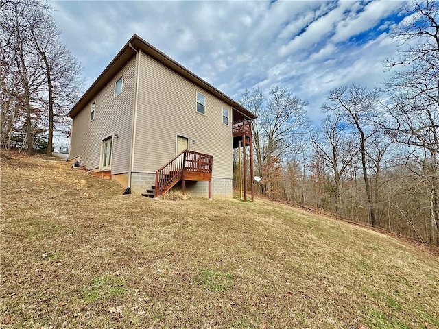 view of side of home featuring a yard