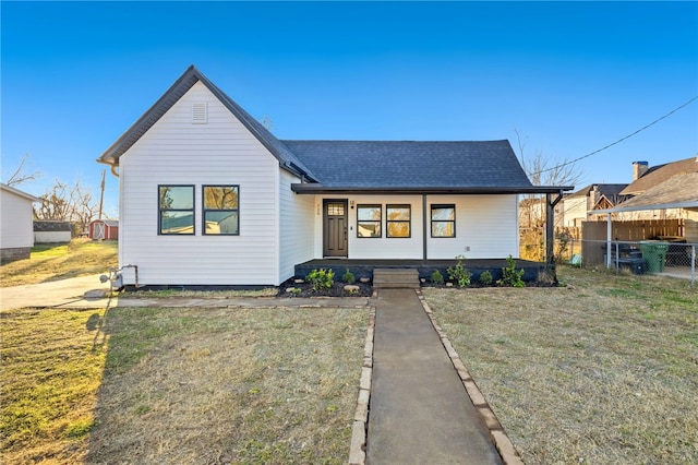 view of front of home featuring covered porch and a front lawn