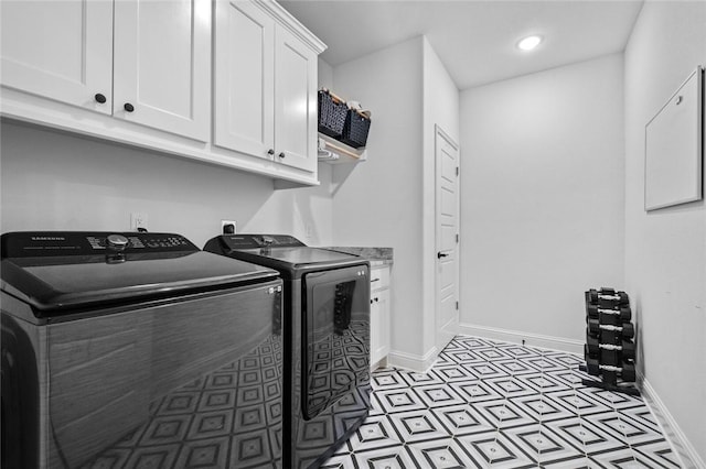 laundry room with cabinets and independent washer and dryer