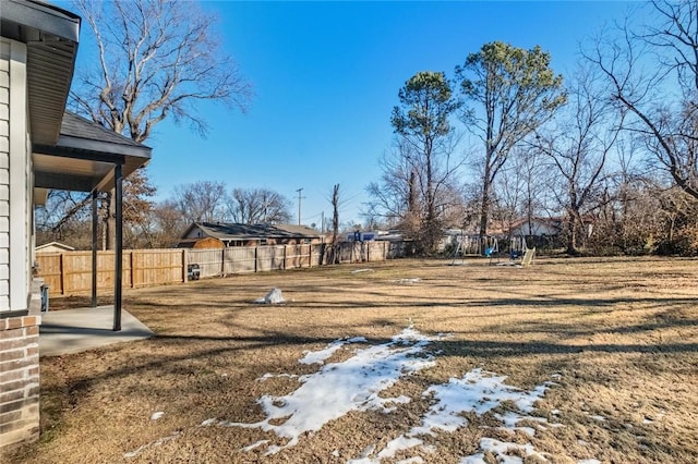 view of yard layered in snow