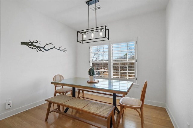 dining area with light wood-type flooring