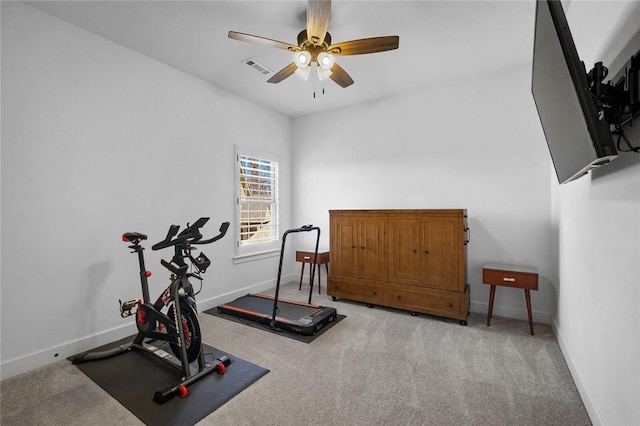 workout area with ceiling fan and light carpet