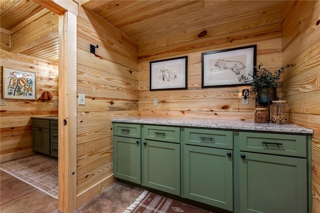 interior space with wood ceiling and wooden walls