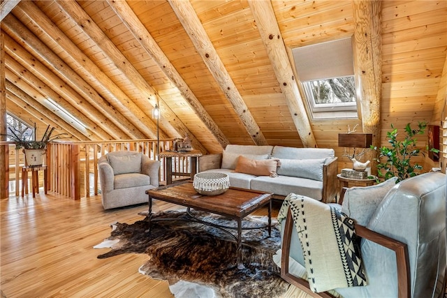 living area with hardwood / wood-style flooring, vaulted ceiling with beams, and wood ceiling