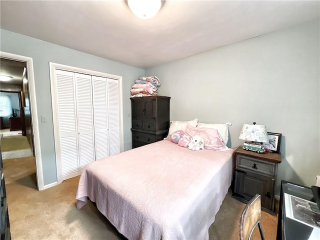 carpeted bedroom with a closet