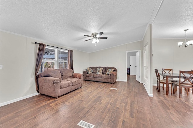 living room with ceiling fan with notable chandelier, crown molding, a textured ceiling, and hardwood / wood-style flooring