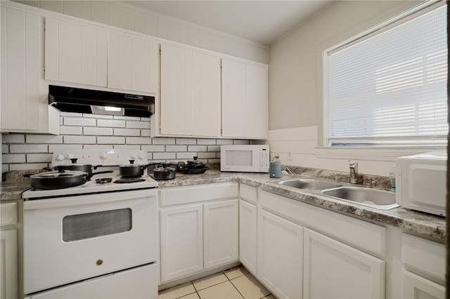 kitchen with white appliances, white cabinetry, sink, light tile patterned floors, and crown molding