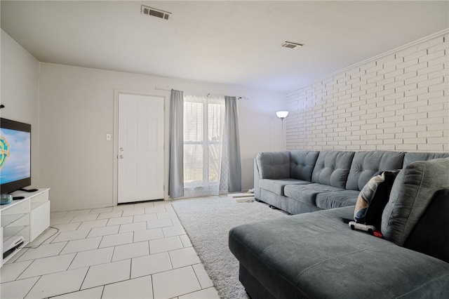 tiled living room with brick wall