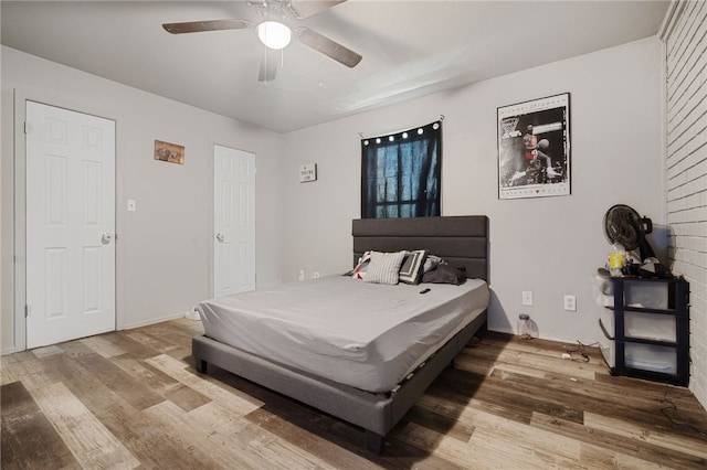 bedroom featuring ceiling fan and wood-type flooring