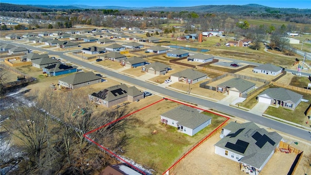 drone / aerial view featuring a mountain view and a residential view