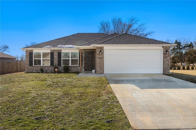 ranch-style home with a garage and a front yard