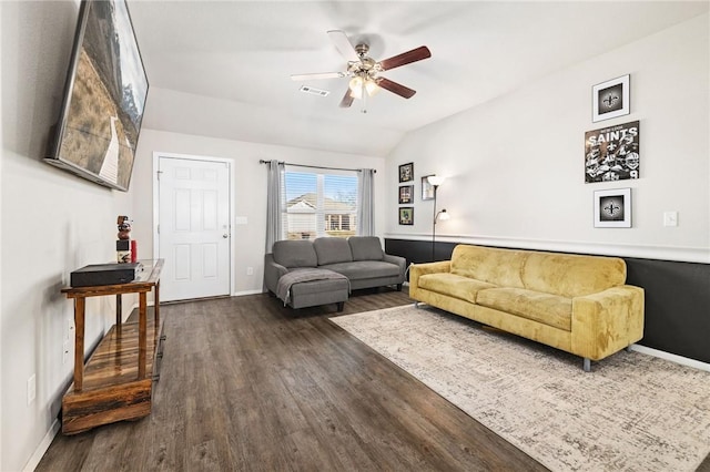 living room with vaulted ceiling, ceiling fan, and dark hardwood / wood-style floors