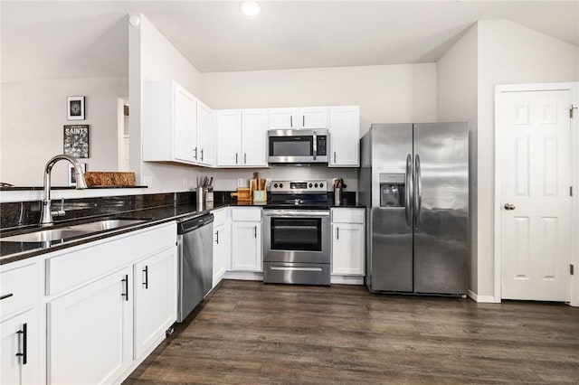 kitchen featuring dark hardwood / wood-style floors, stainless steel appliances, white cabinets, and sink