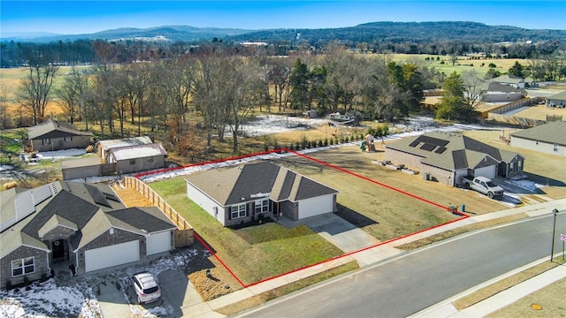 birds eye view of property featuring a mountain view