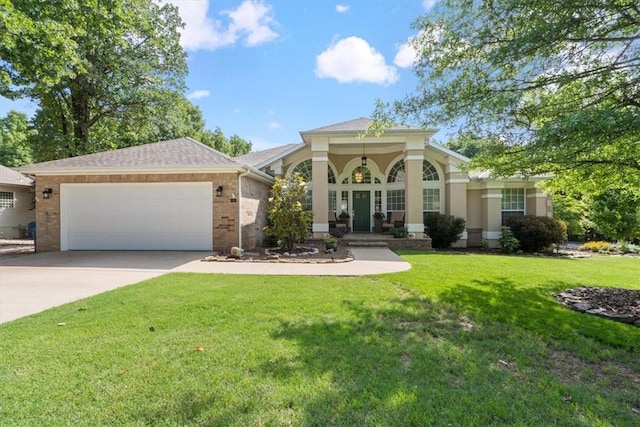 view of front facade with a front lawn and a garage