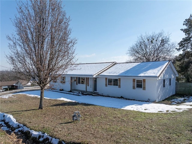 single story home featuring a yard