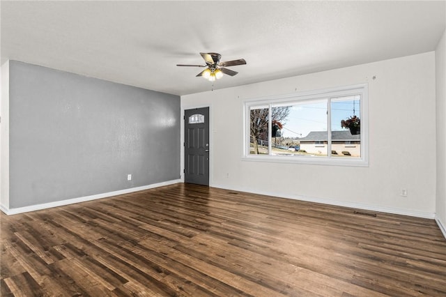 interior space featuring ceiling fan and dark hardwood / wood-style floors