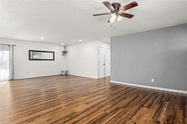 interior space with ceiling fan and dark hardwood / wood-style floors