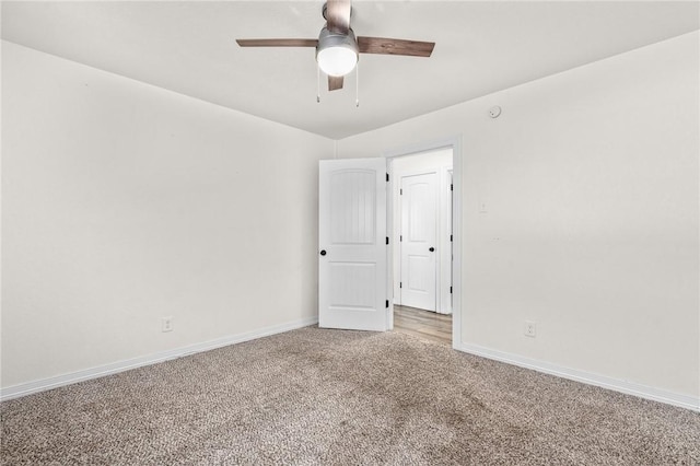 carpeted empty room with ceiling fan