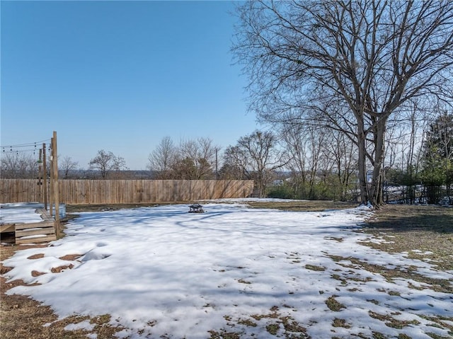 view of yard covered in snow