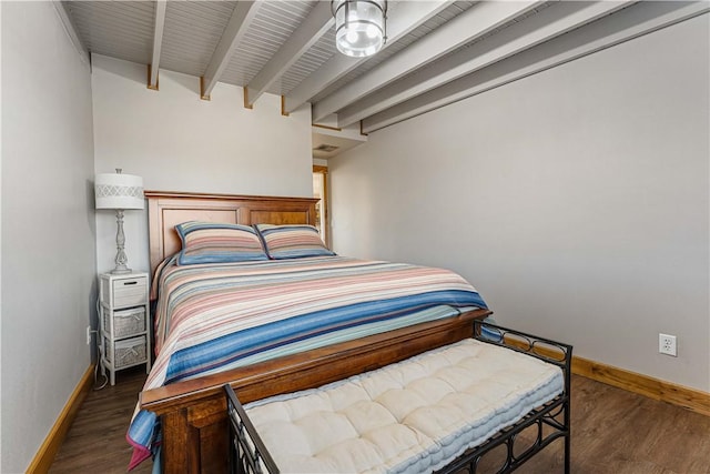 bedroom featuring dark hardwood / wood-style flooring and beamed ceiling