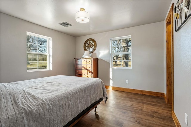 bedroom featuring dark wood-type flooring