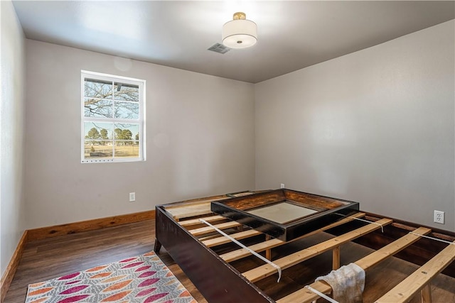 unfurnished bedroom featuring wood-type flooring