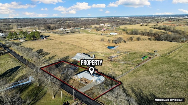 birds eye view of property with a rural view