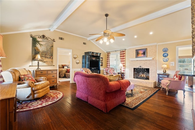 living room featuring ceiling fan, dark hardwood / wood-style floors, a fireplace, ornamental molding, and lofted ceiling with beams