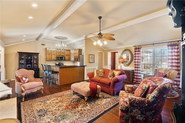 living room featuring ceiling fan with notable chandelier, ornamental molding, lofted ceiling with beams, and dark hardwood / wood-style floors