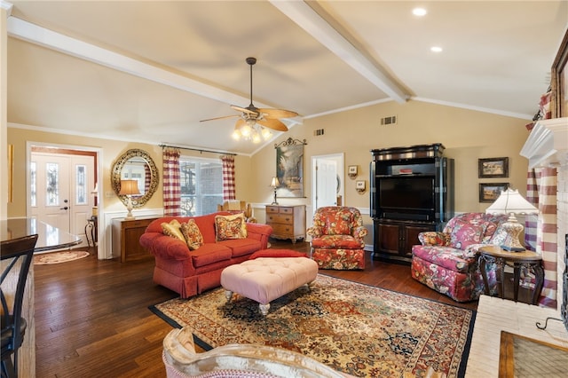 living room featuring dark wood-type flooring, ceiling fan, crown molding, and vaulted ceiling with beams