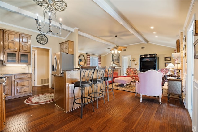 kitchen with dark hardwood / wood-style floors, ceiling fan with notable chandelier, tasteful backsplash, lofted ceiling with beams, and a kitchen bar