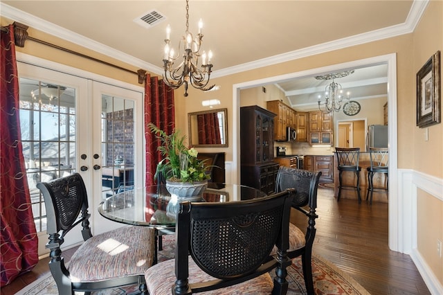 dining area with dark hardwood / wood-style floors, ornamental molding, and french doors