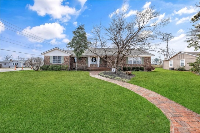 single story home with a front yard