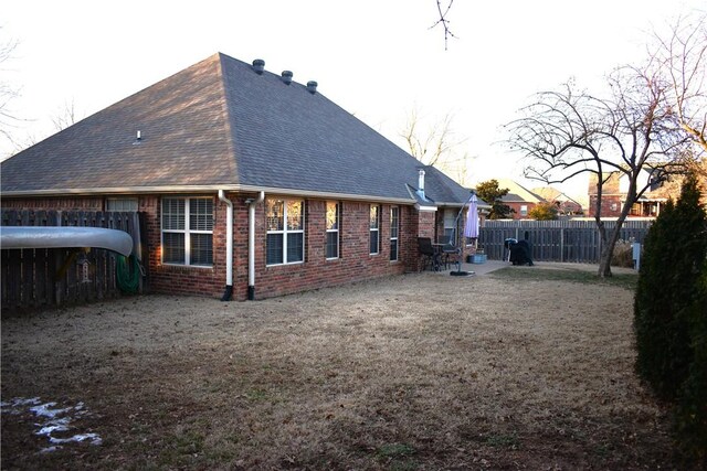 rear view of property featuring a patio