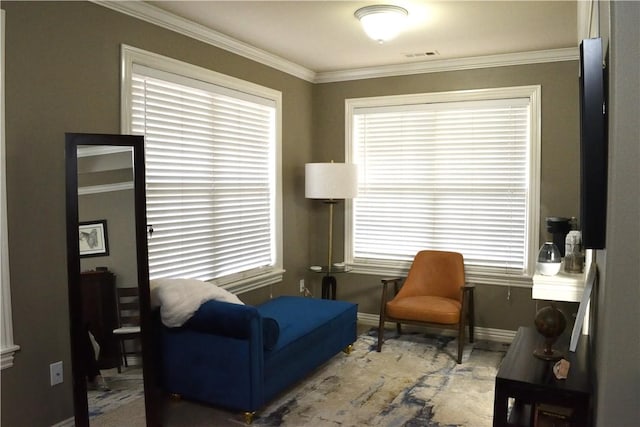 living area featuring ornamental molding