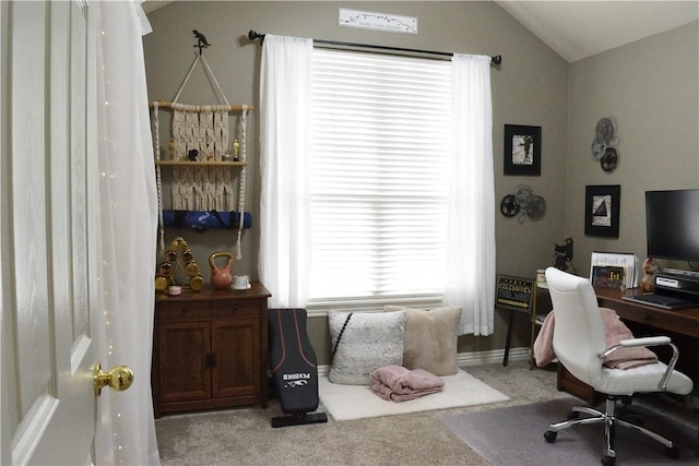 home office with carpet floors and vaulted ceiling