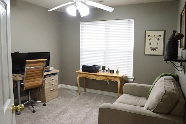 carpeted office featuring ceiling fan