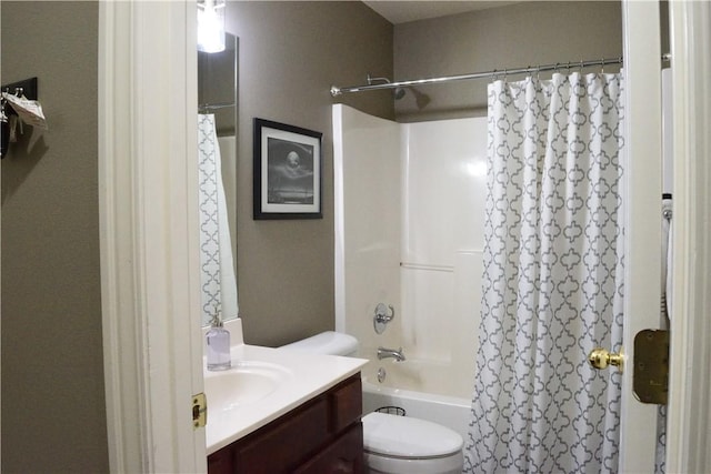 full bathroom featuring vanity, shower / bath combo, and toilet