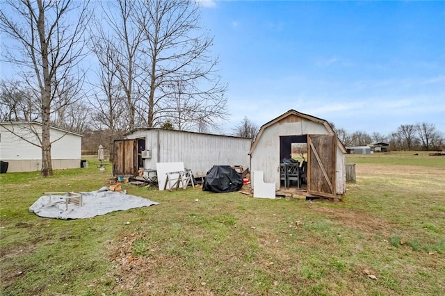 view of outbuilding featuring a yard